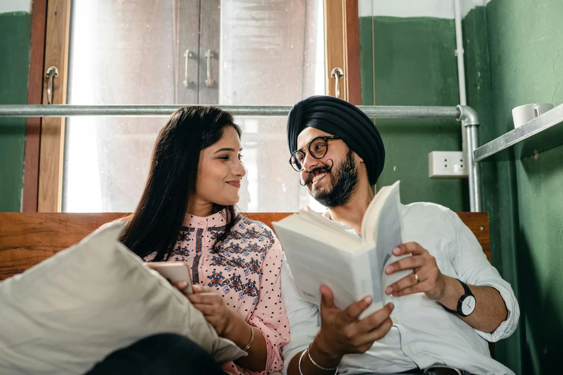 Open book with wedding rings — commitment and lifelong learning